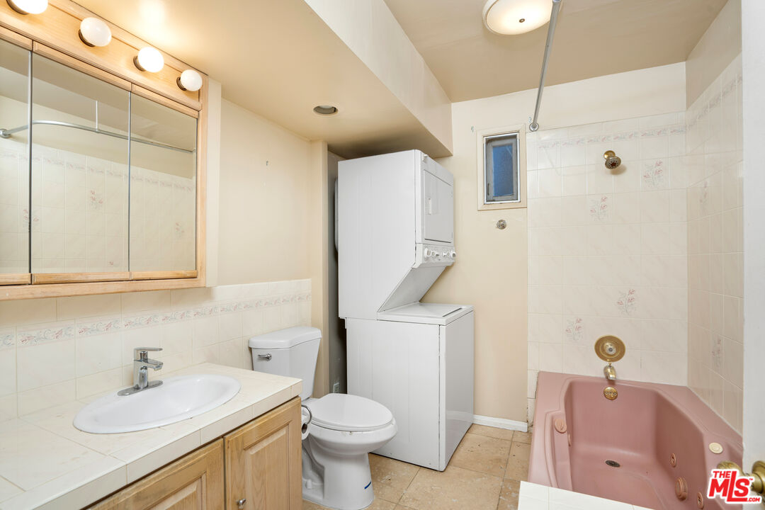 12334 Moorpark Street Studio City, CA 91604 - Photo 12 of 33 a bathroom with a sink toilet and shower