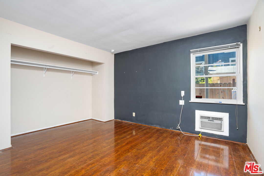 12334 Moorpark Street Studio City, CA 91604 - Photo 13 of 33 a view of empty room with wooden floor and fan