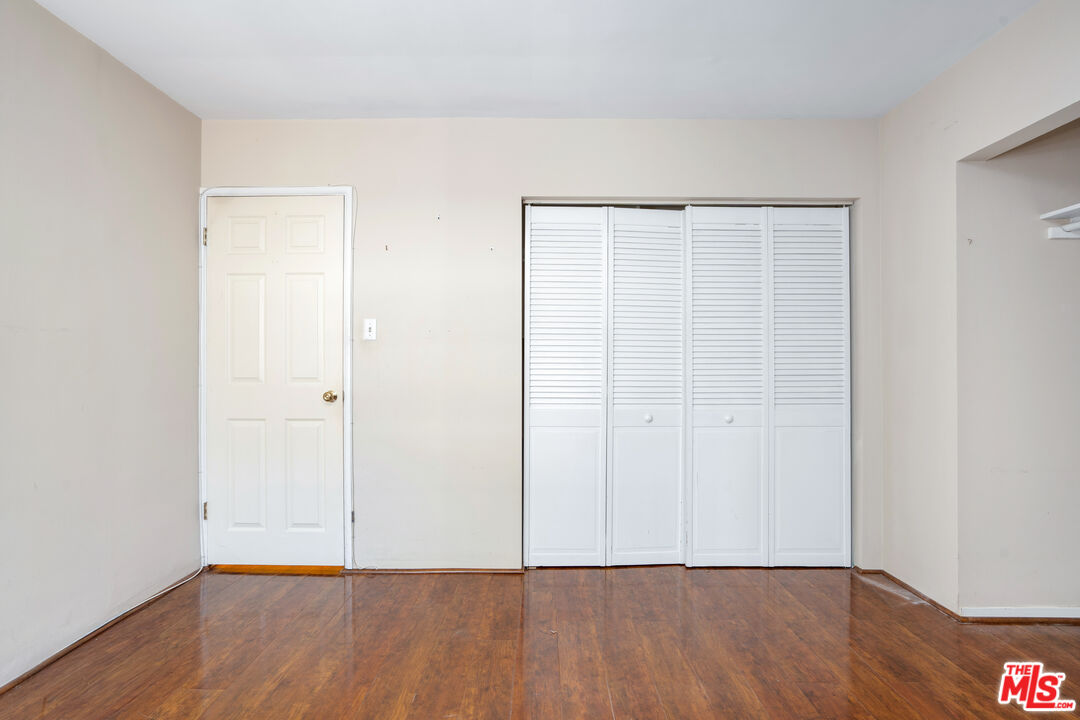 12334 Moorpark Street Studio City, CA 91604 - Photo 14 of 33 a view of an empty room with wooden floor
