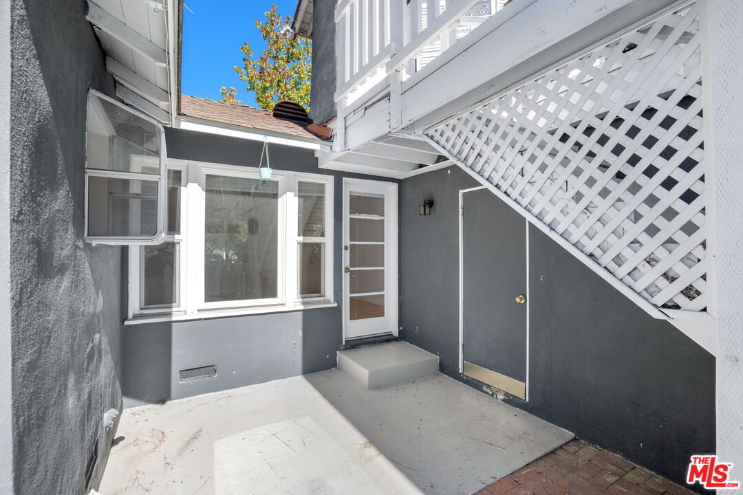 12334 Moorpark Street Studio City, CA 91604 - Photo 5 of 33 a view of a brick house with a large window