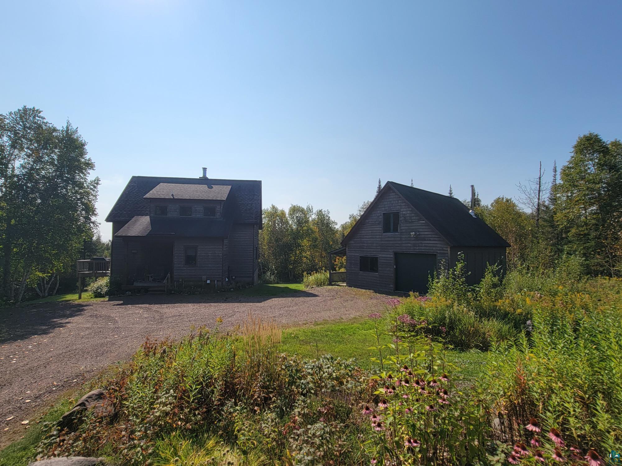 184 Fall River Road Grand Marais, MN 55604 - Photo 12 of 50 Exterior space featuring a garage