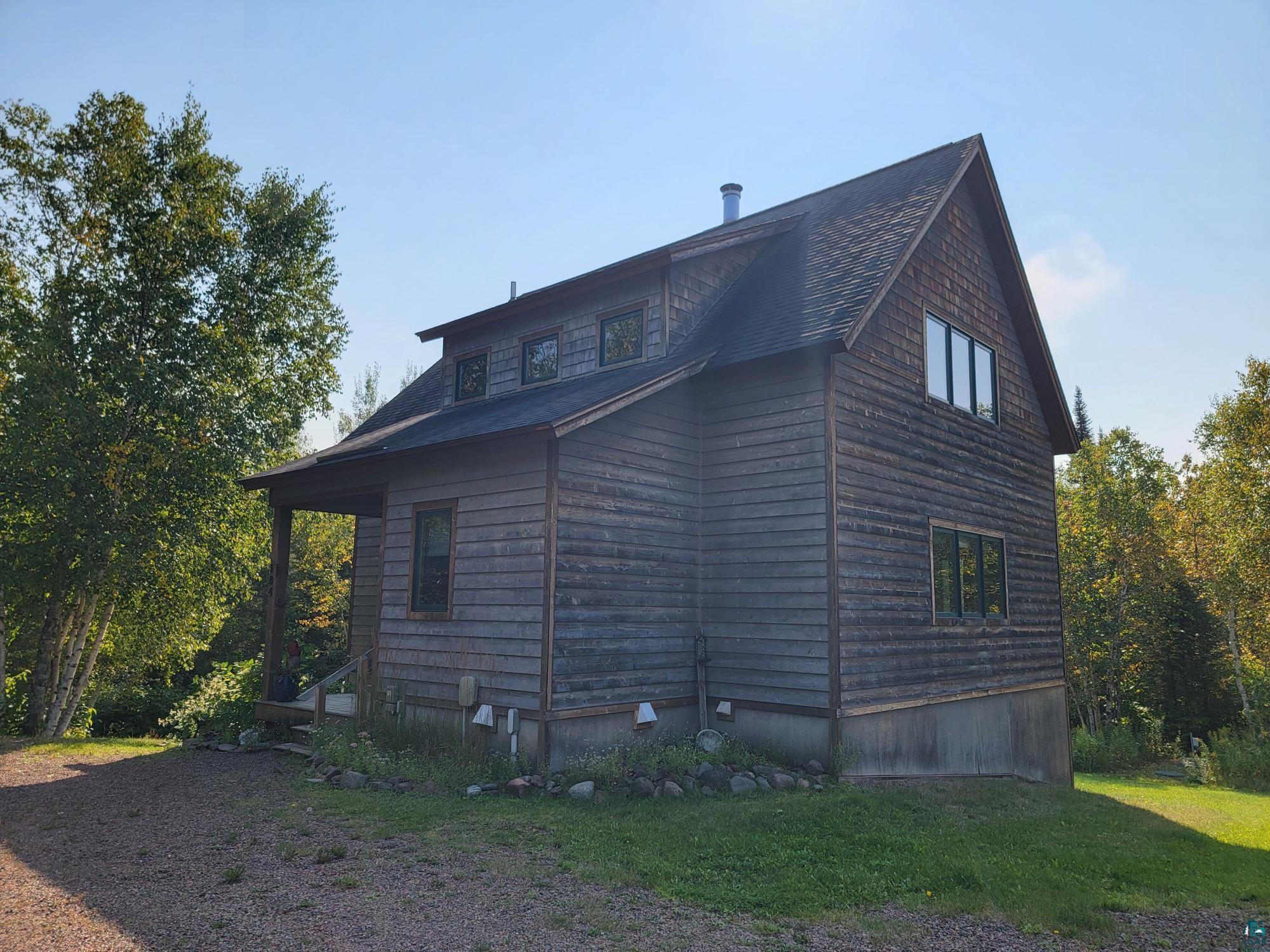 184 Fall River Road Grand Marais, MN 55604 - Photo 13 of 50 View of side of home with a yard