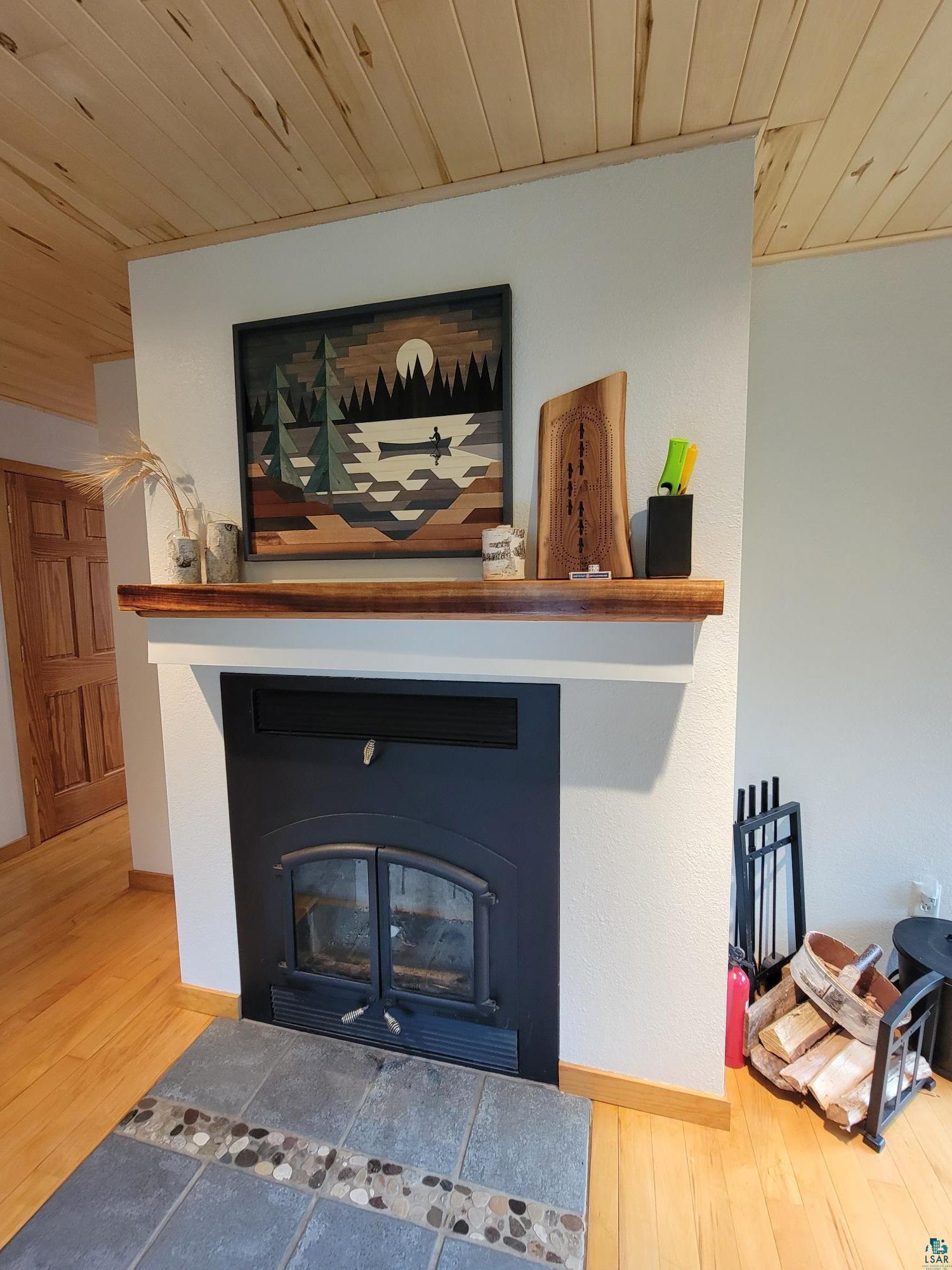 184 Fall River Road Grand Marais, MN 55604 - Photo 21 of 50 Interior details featuring wooden ceiling and hardwood / wood-style flooring