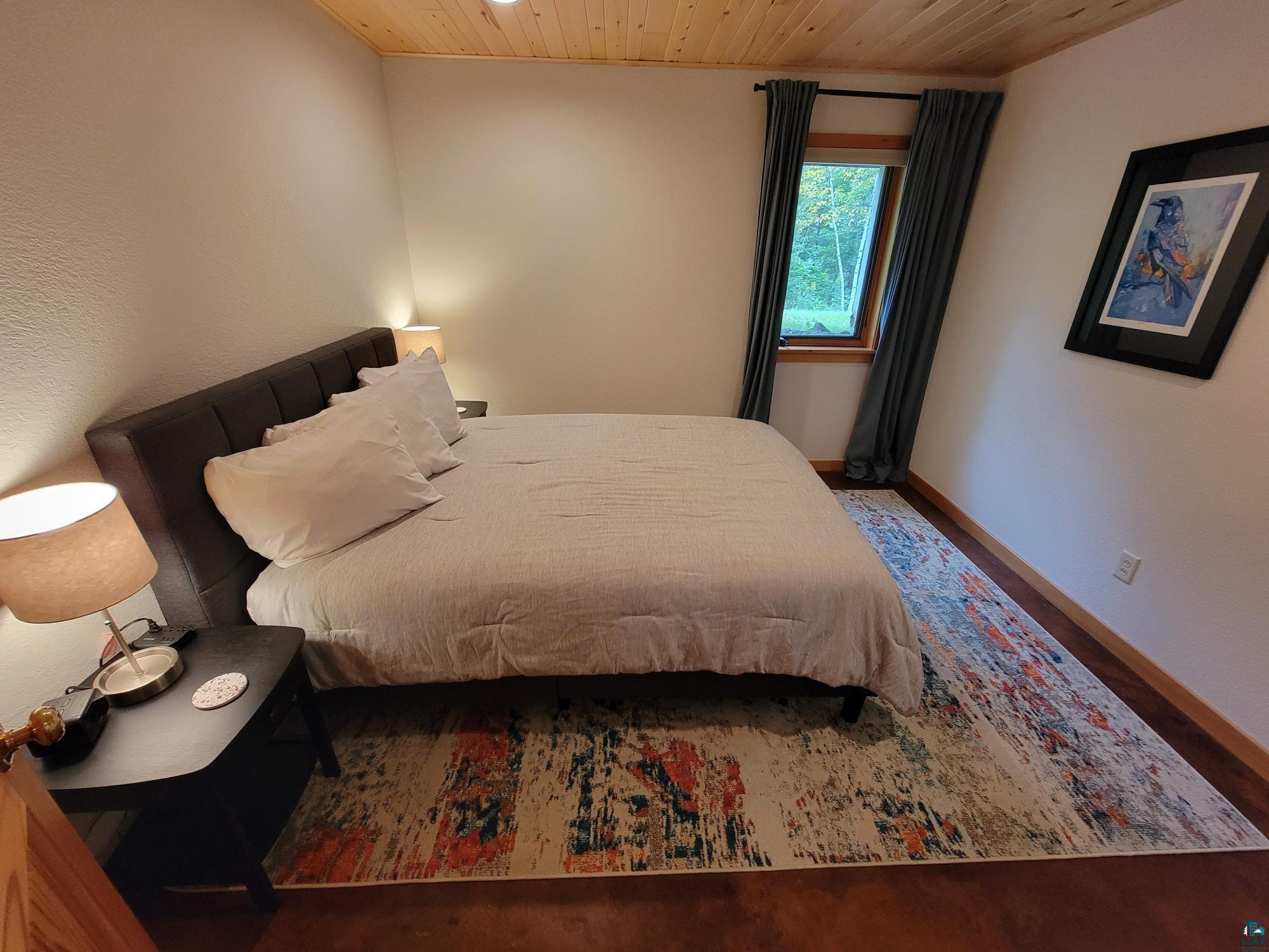 184 Fall River Road Grand Marais, MN 55604 - Photo 39 of 50 Bedroom with wooden ceiling