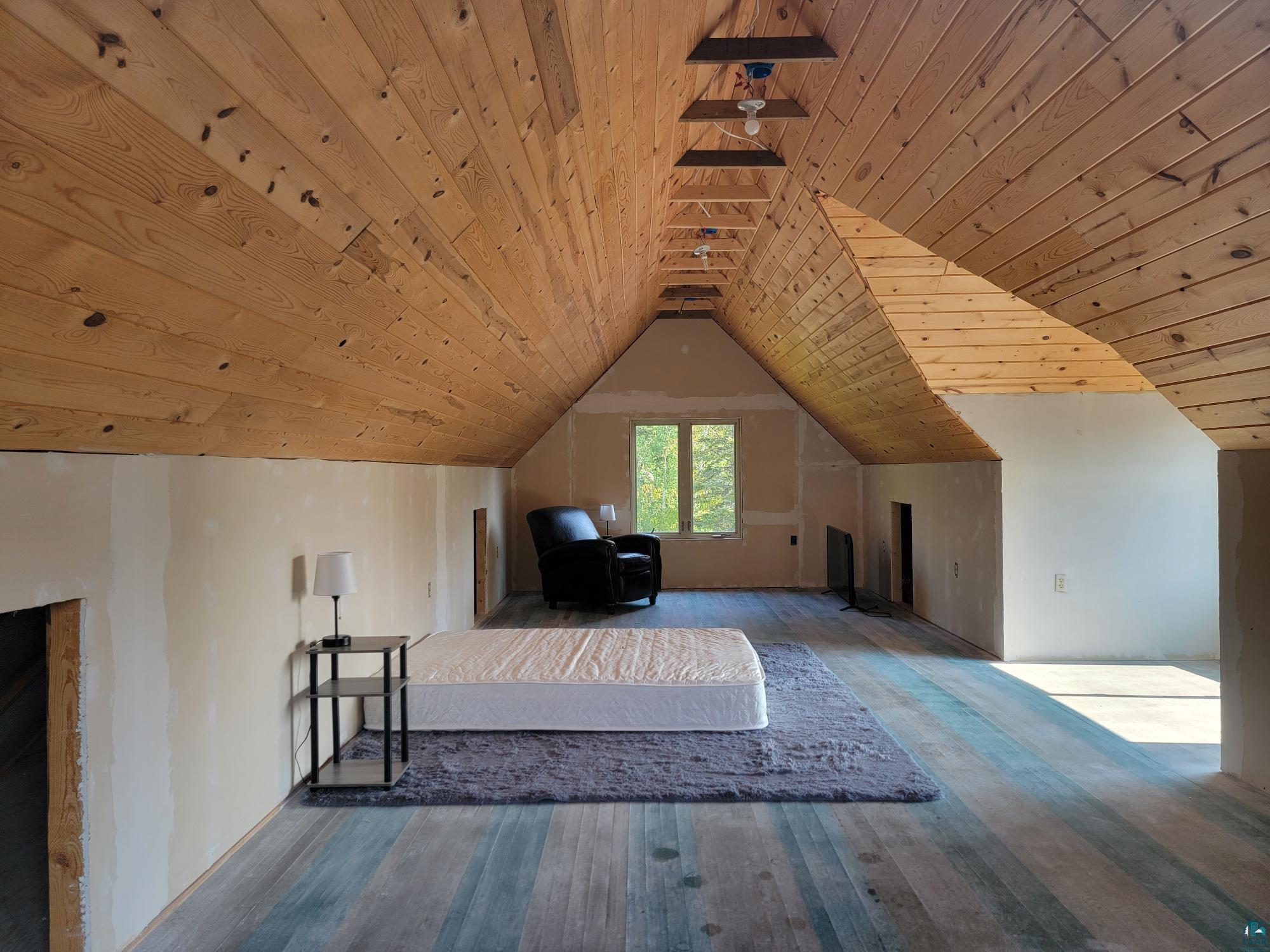 184 Fall River Road Grand Marais, MN 55604 - Photo 47 of 50 Additional living space featuring wood ceiling, vaulted ceiling, and hardwood / wood-style floors
