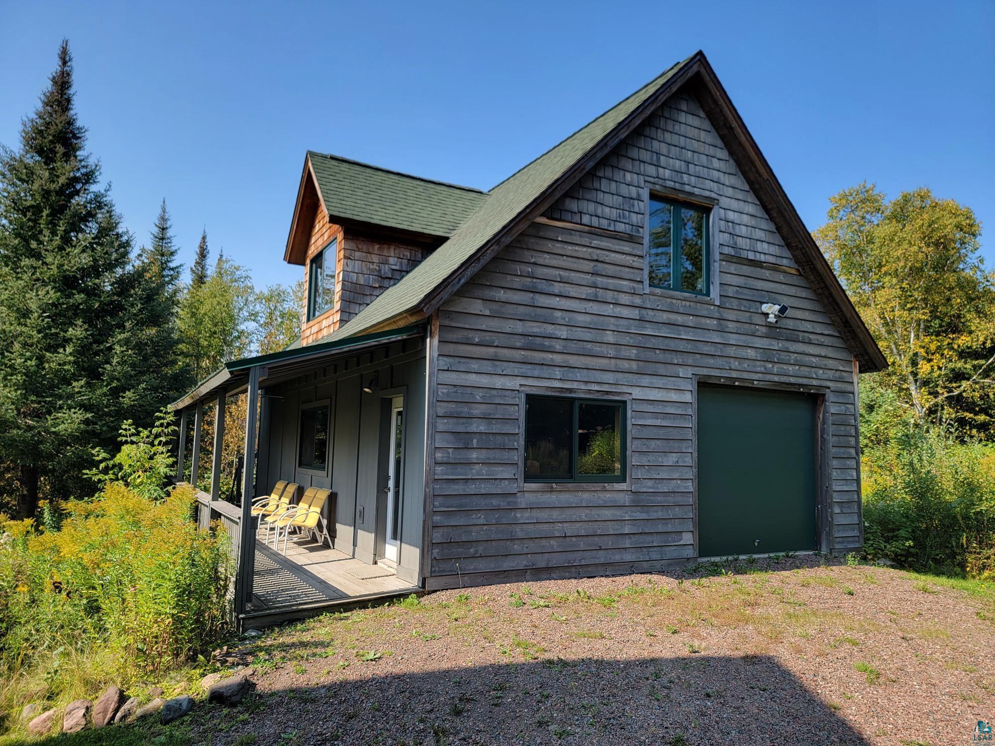 184 Fall River Road Grand Marais, MN 55604 - Photo 10 of 50 Exterior space with a garage