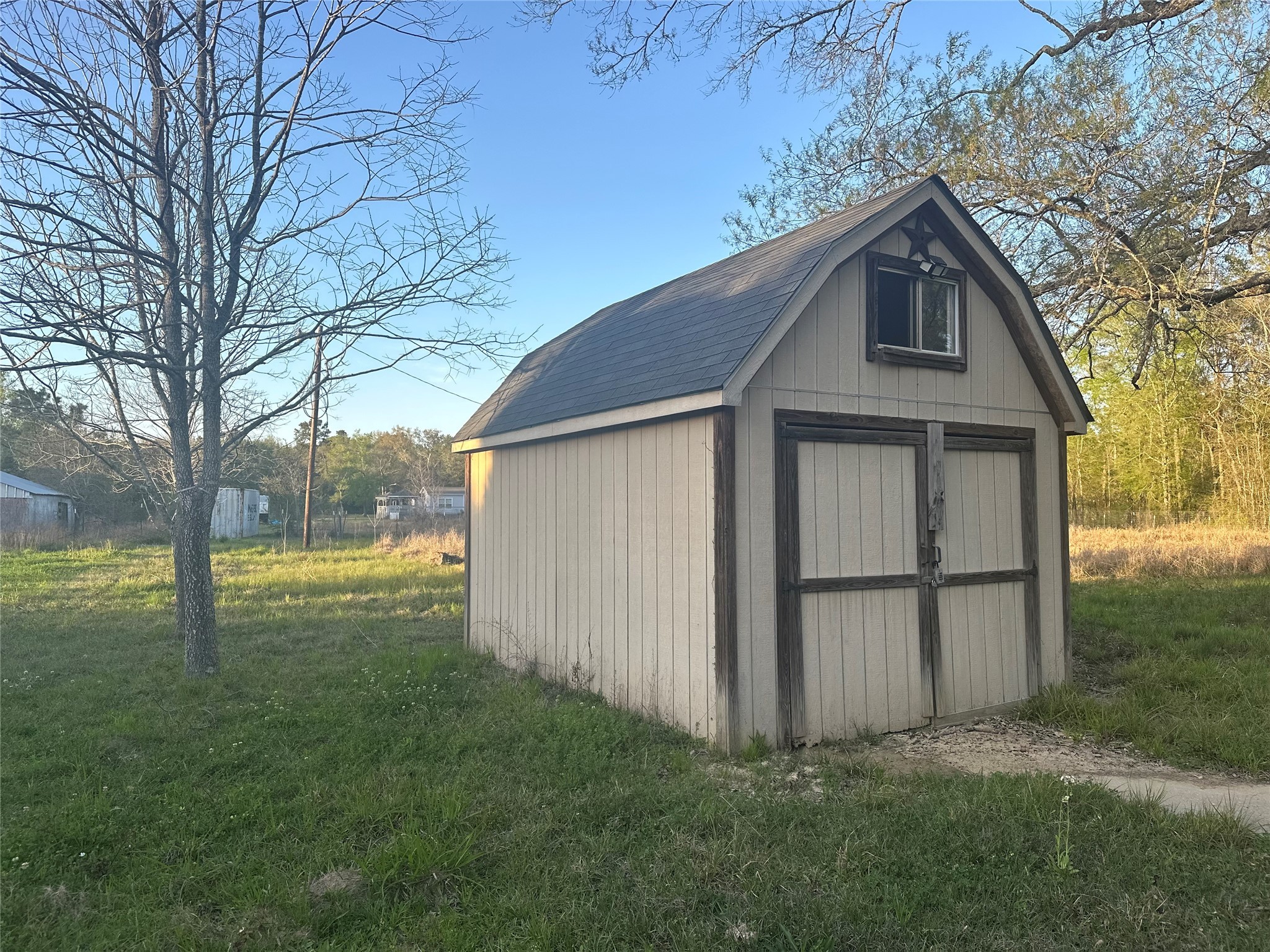 650 Our Road Shepherd, TX 77371 - Photo 19 of 19 a view of a backyard with large trees