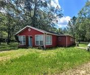 650 Our Road Shepherd, TX 77371 - Photo 2 of 19 a view of a house with a yard