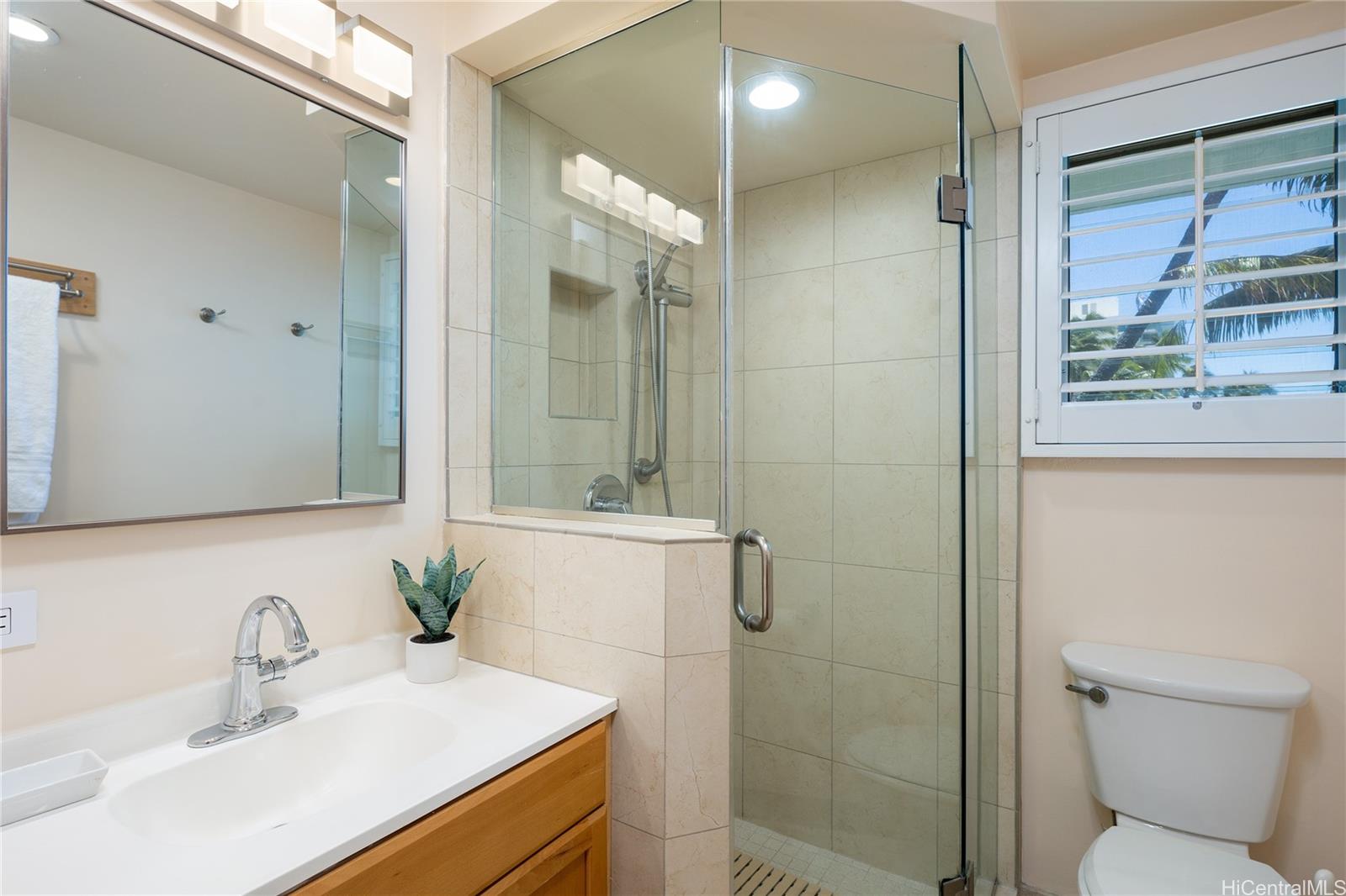 2957 Kalakaua Avenue, Unit 418 Honolulu, HI 96815 - Photo 14 of 25 a bathroom with a sink toilet and shower