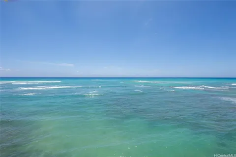 a view of a swimming pool with an outdoor seating and a yard