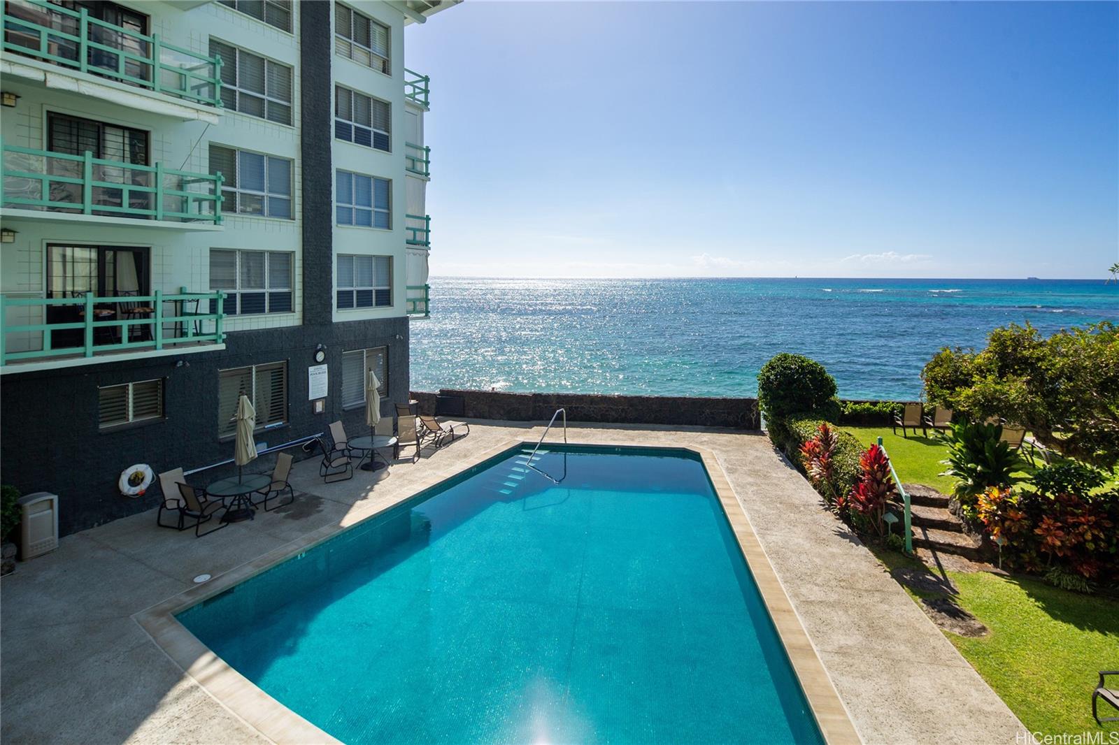 2957 Kalakaua Avenue, Unit 418 Honolulu, HI 96815 - Photo 20 of 25 a view of a swimming pool with an outdoor seating and a yard