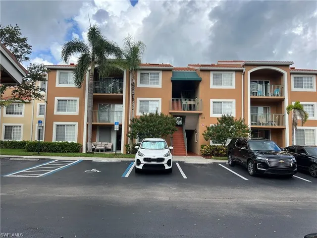 a car parked in front of a brick building