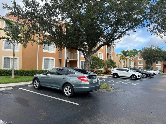 a view of street with parked cars
