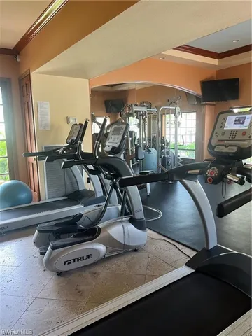 a room with pool tables and windows