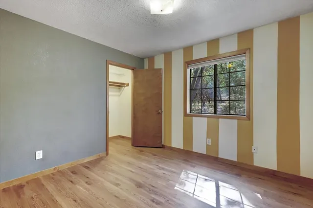 a backyard of a house with lots of green space