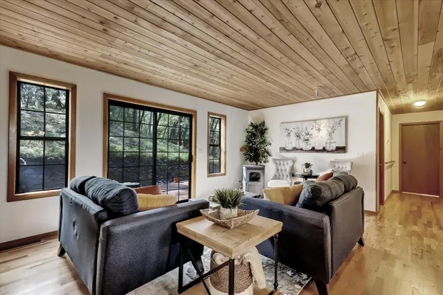 a dining room with furniture and window