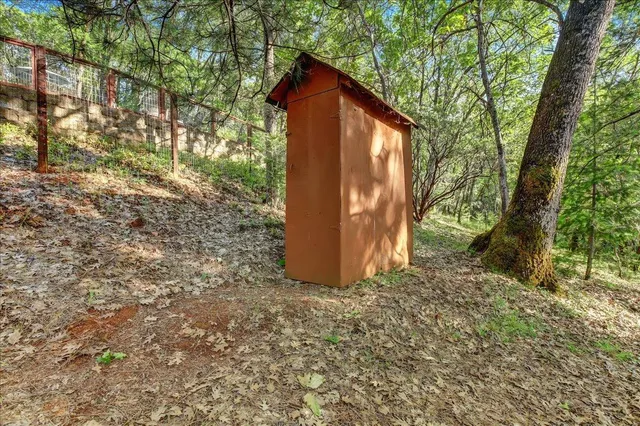 a backyard of a house with lots of green space