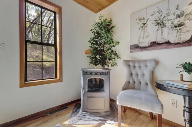 a spacious bedroom with a bed and a chandelier