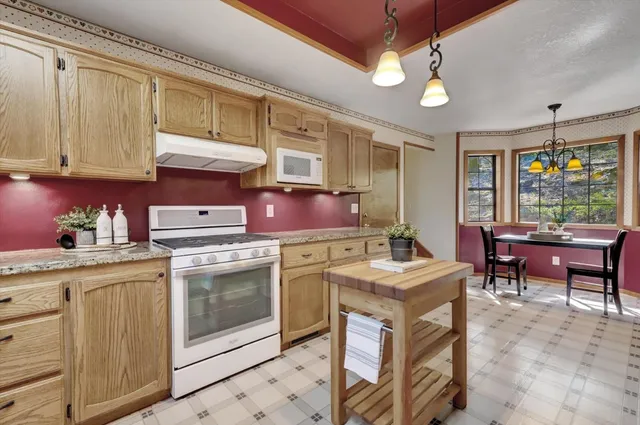 a workspace with furniture and a window