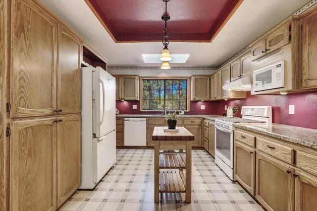 a work room with furniture and wooden floor