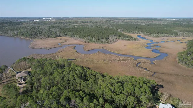 an aerial view of ocean with beach