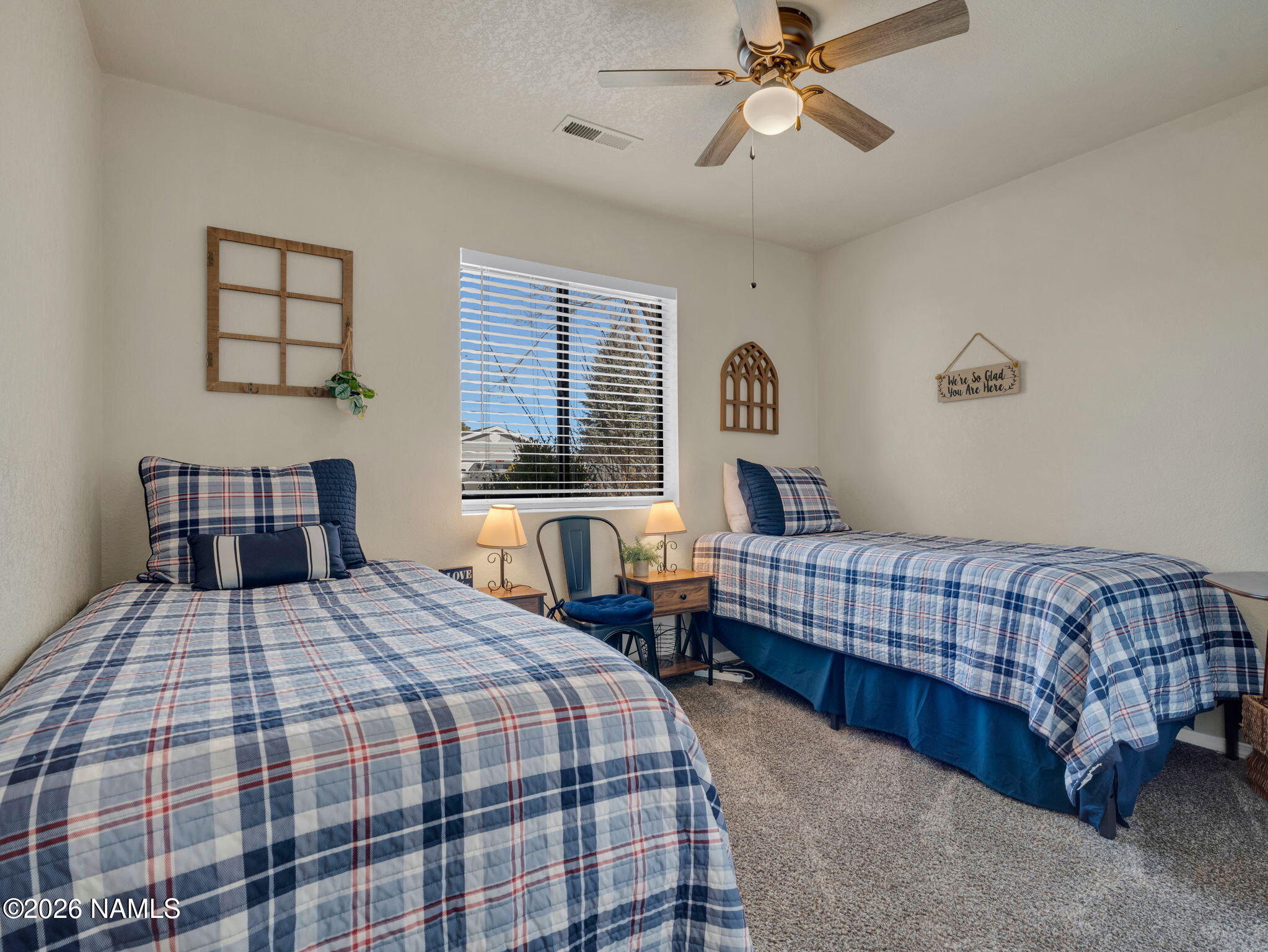 1105 West Morse Avenue Williams, AZ 86046 - Photo 11 of 26 a bedroom with a bed and window