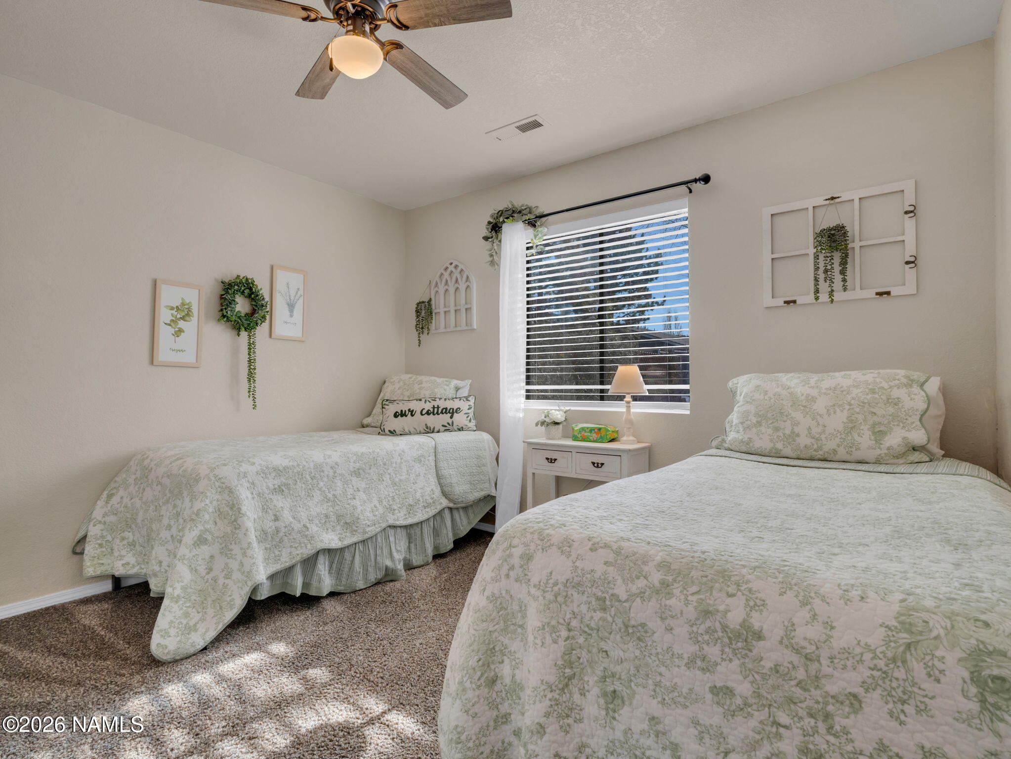 1105 West Morse Avenue Williams, AZ 86046 - Photo 12 of 26 a bedroom with two beds and ceiling fan