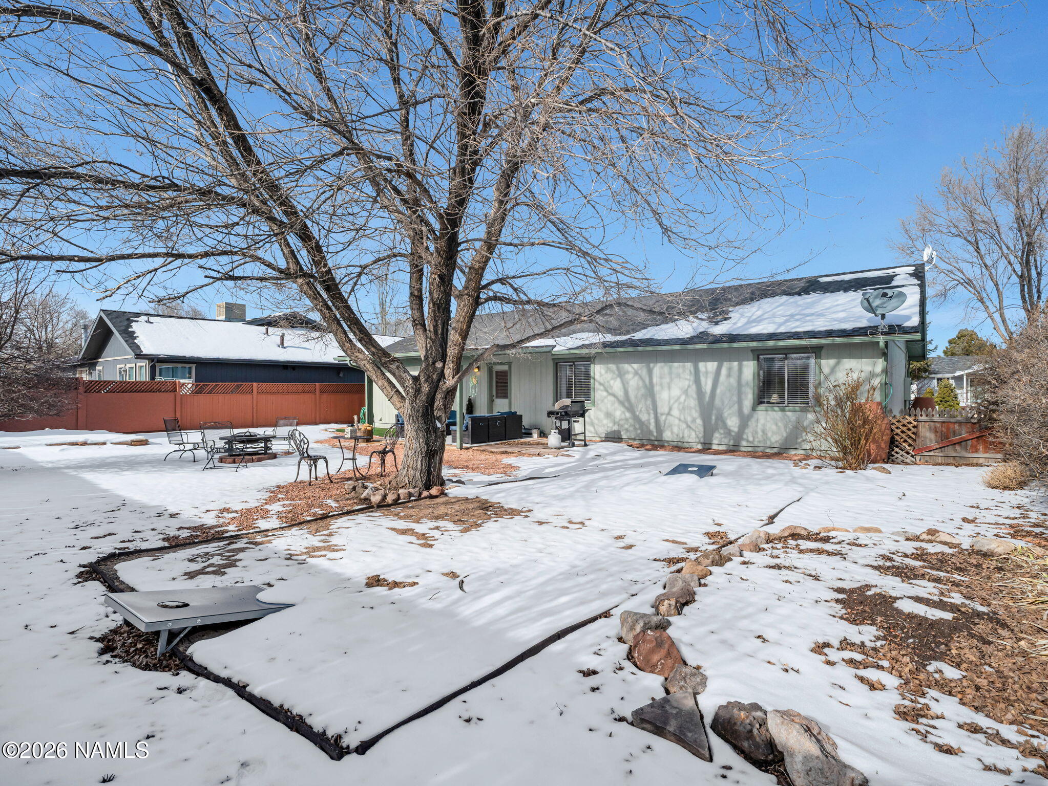 1105 West Morse Avenue Williams, AZ 86046 - Photo 24 of 26 a view of a backyard with a large tree