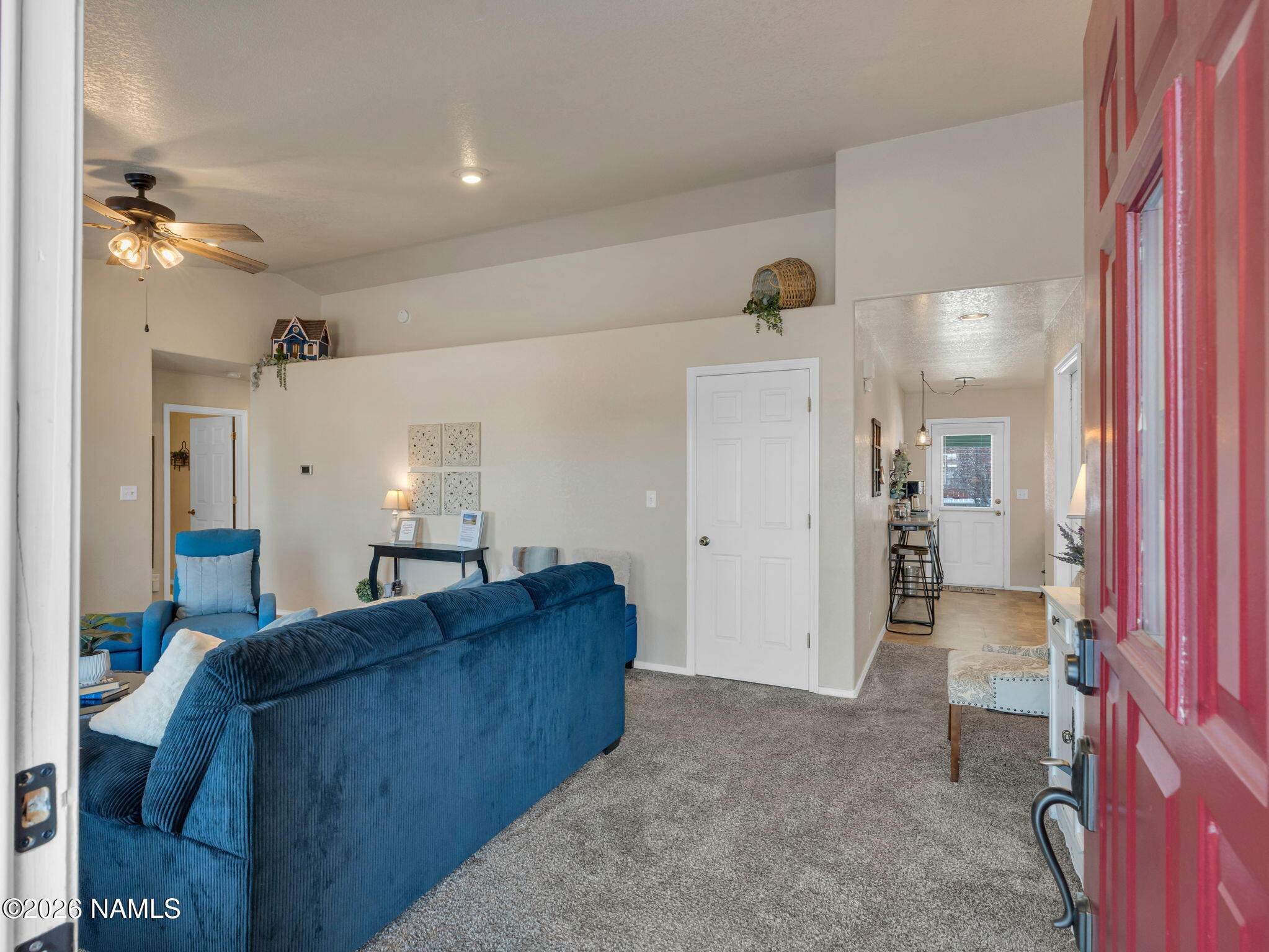 1105 West Morse Avenue Williams, AZ 86046 - Photo 3 of 26 a living room with furniture and a chandelier