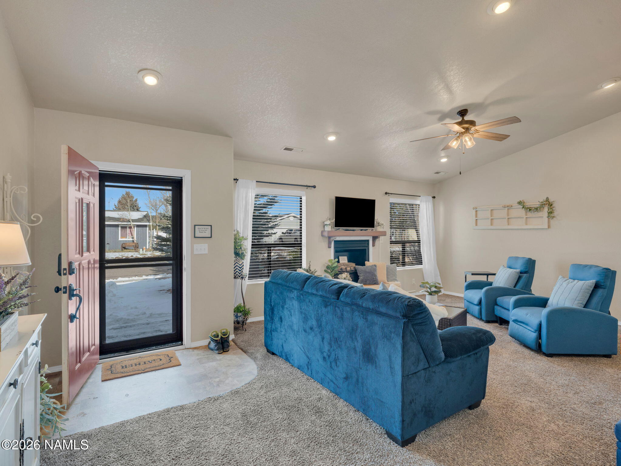 1105 West Morse Avenue Williams, AZ 86046 - Photo 4 of 26 a living room with furniture and a flat screen tv