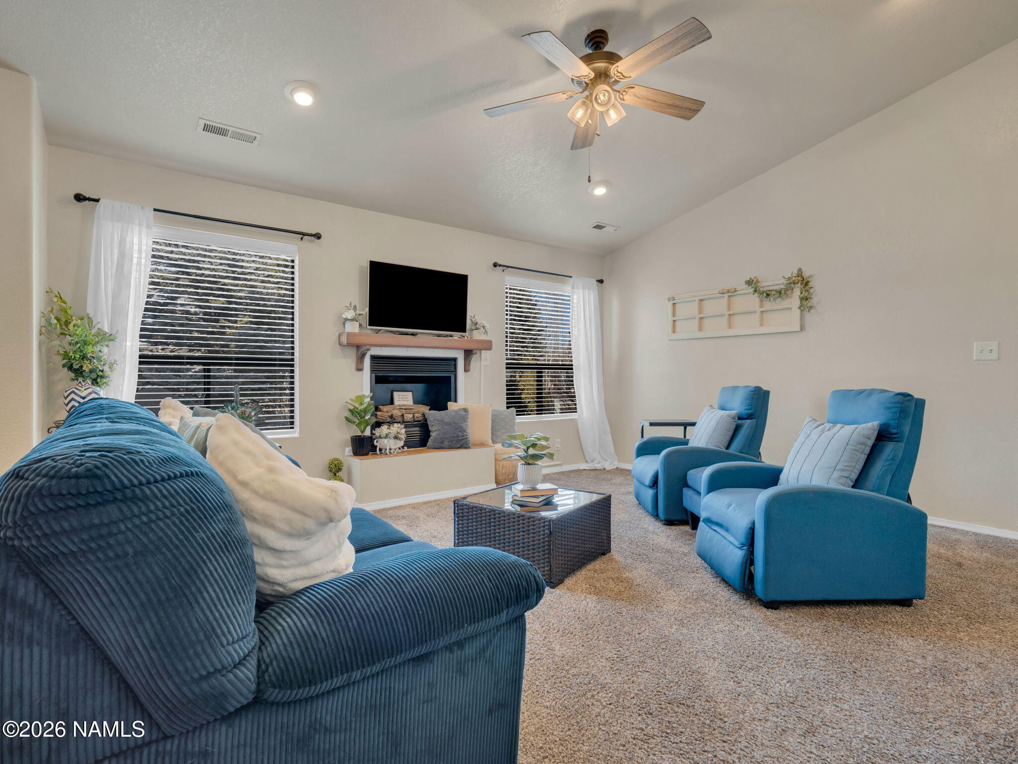 1105 West Morse Avenue Williams, AZ 86046 - Photo 5 of 26 a living room with furniture ceiling fan and a flat screen tv