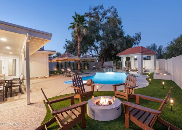 a patio with a table and chairs
