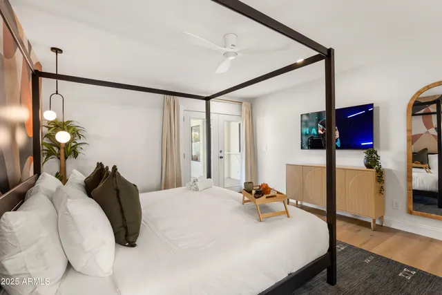 a bedroom with a bed and cabinets