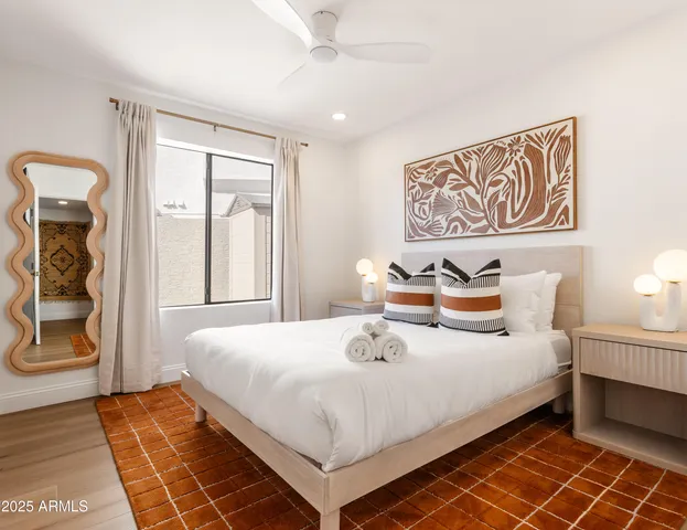 a bedroom with a bed and a window