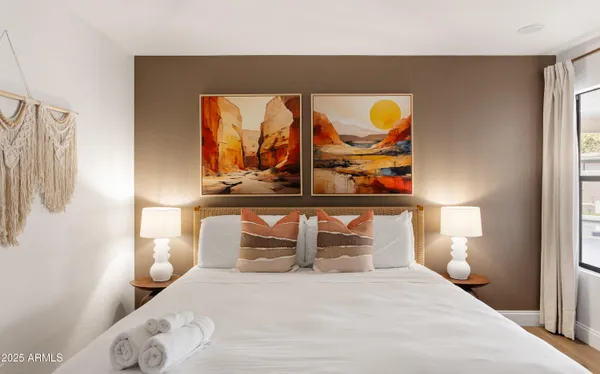 a bedroom with a bed and window