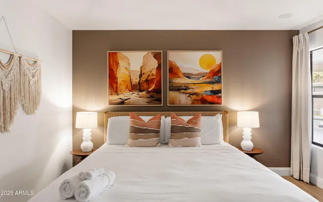 a bedroom with a bed and window