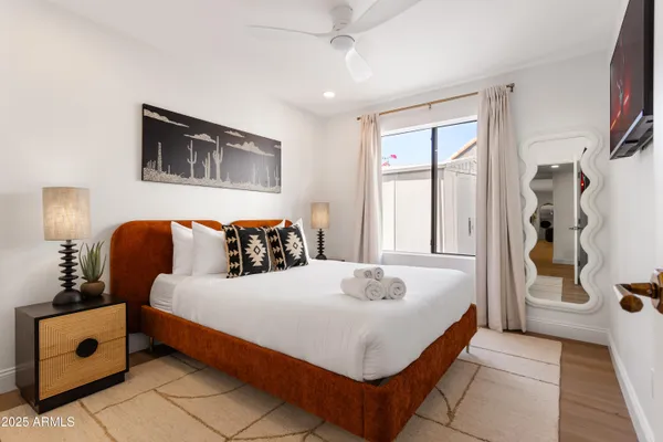 a bedroom with a bed and a window
