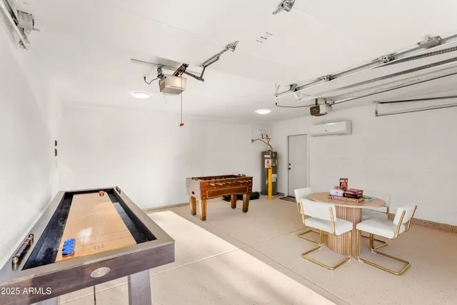 a work room with furniture and white walls