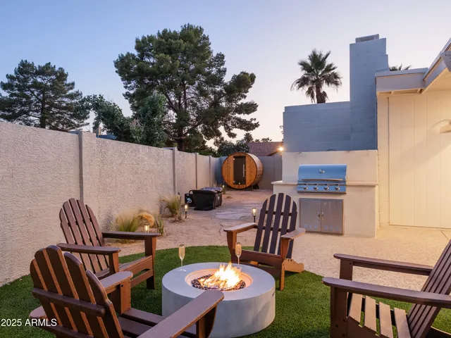 a view of a patio with table and chairs potted plants with wooden floor