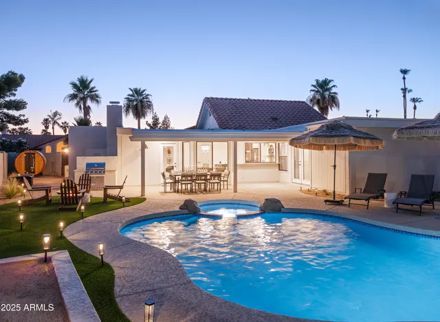 a view of a swimming pool with a patio