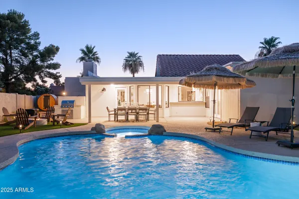 a view of pool table and chairs in patio