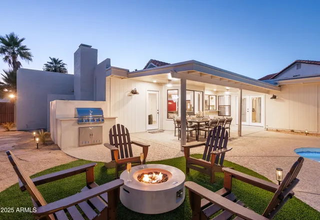 a view of a chairs and table in the patio