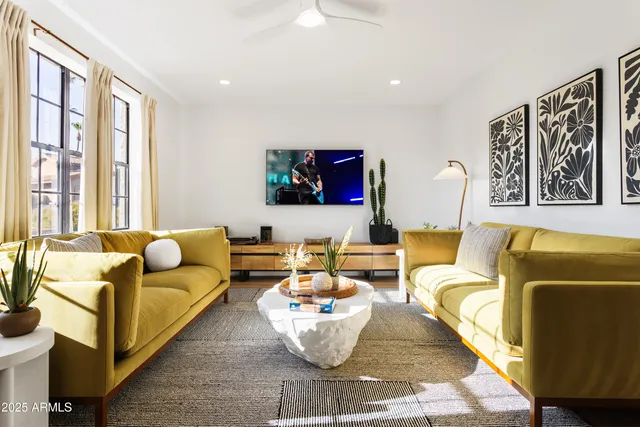 a living room with furniture and a flat screen tv