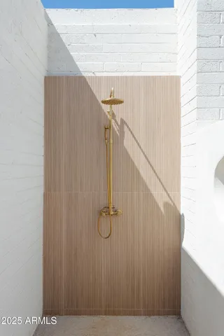 a view of a chairs and table in backyard