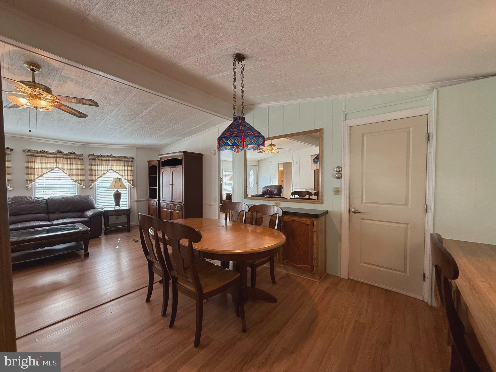 386 Indian Way Buena, NJ 08310 - Photo 10 of 53 a dining room with furniture window and wooden floor