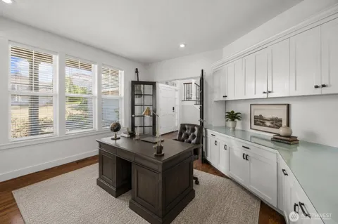 a kitchen with stainless steel appliances granite countertop a stove and a refrigerator