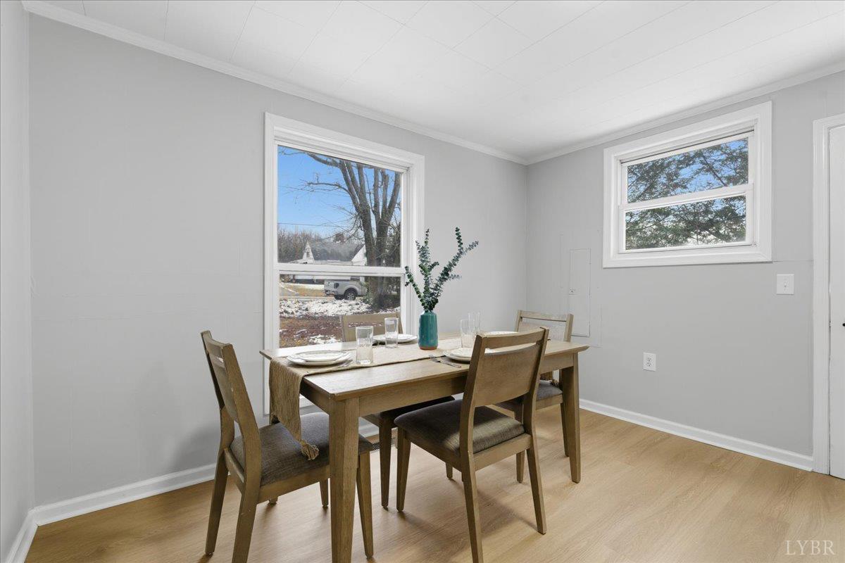 a view of a dining room with furniture and wooden floor