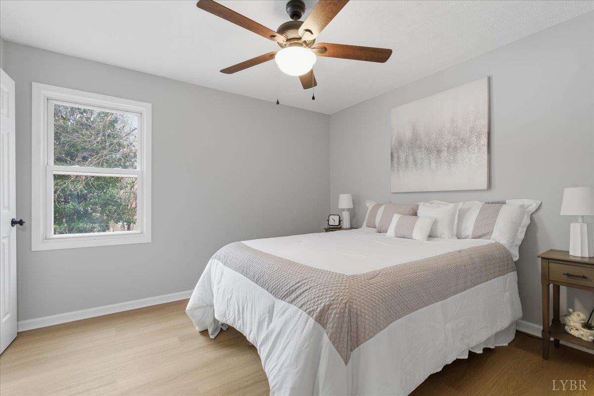 503 Prospect Road Hurt, VA 24563 - Photo 3 of 33 a bedroom with a bed and a chandelier