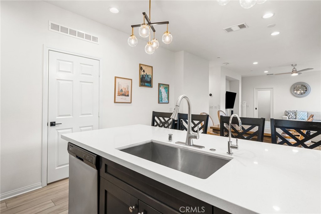 329 North Standard Avenue Santa Ana, CA 92701 - Photo 13 of 34 a view of a kitchen counter space a sink and living room view