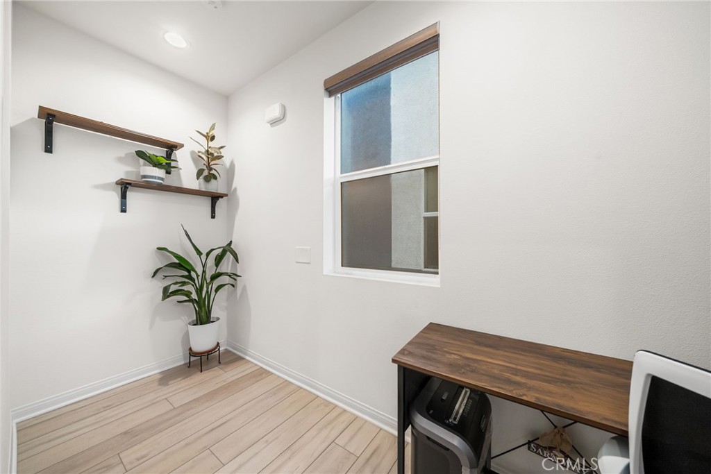 329 North Standard Avenue Santa Ana, CA 92701 - Photo 16 of 34 a view of a workspace with furniture and wooden floor